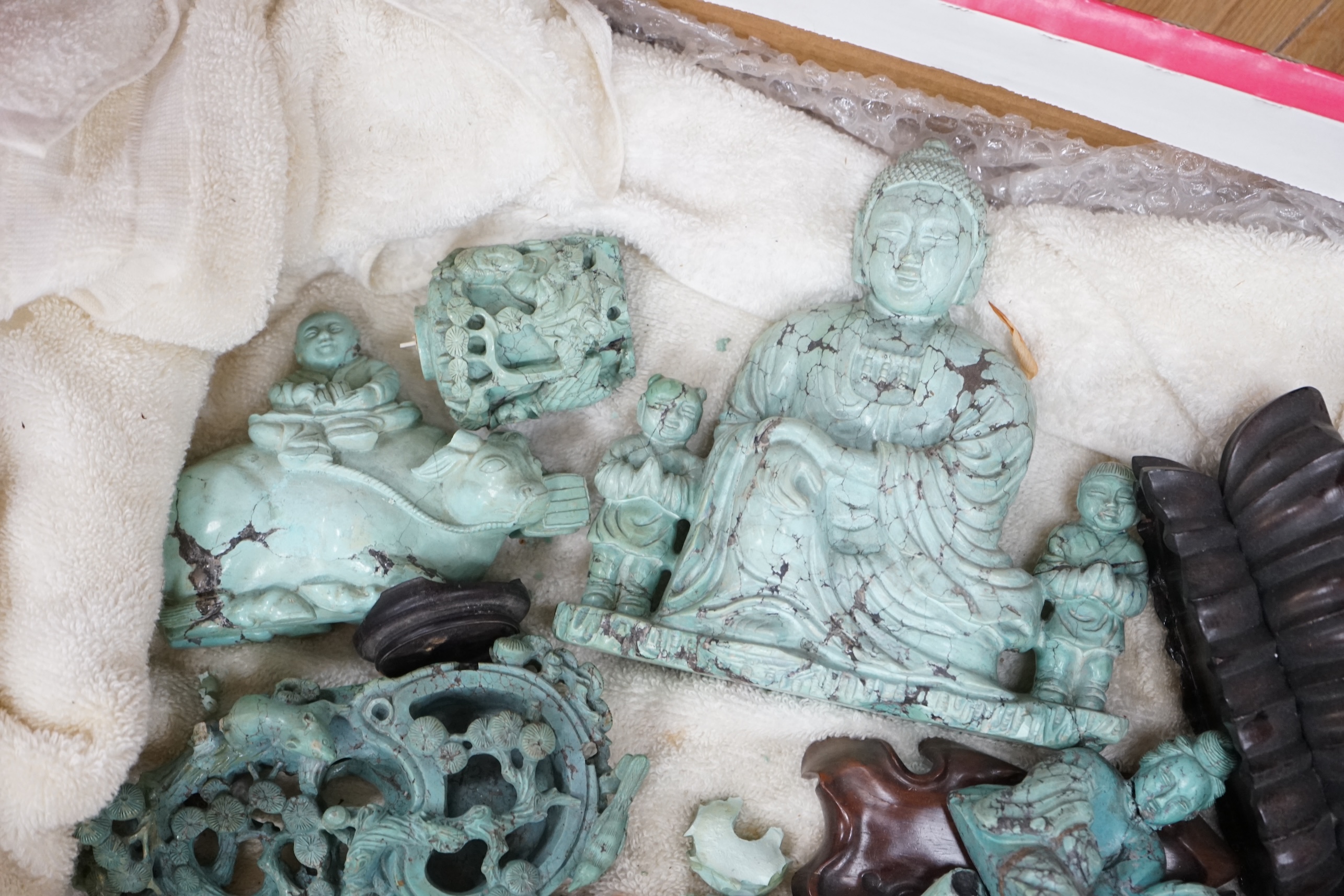 A group of Chinese turquoise matrix carvings, comprising a boy on a buffalo, 5.5in. a brushwasher, 7in. a vase and cover, 6.5in. a snuff bottle and a figure of a woman, 4.5in. (all a.f.)